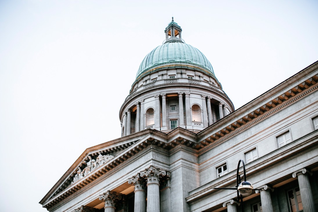 Neoclassical dome and columned exterior of Singapore's former Supreme Court building.