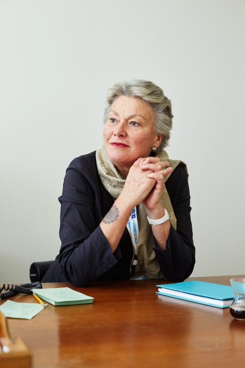 Sophie Louyot, acting head of the UN interpretation service, sits at a desk wearing a dark blazer and beige scarf.