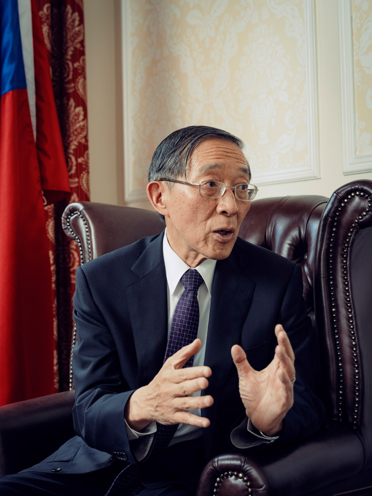 David Lin, Taiwan's representative to the UK, speaking during an interview in his London office with a flag behind him.