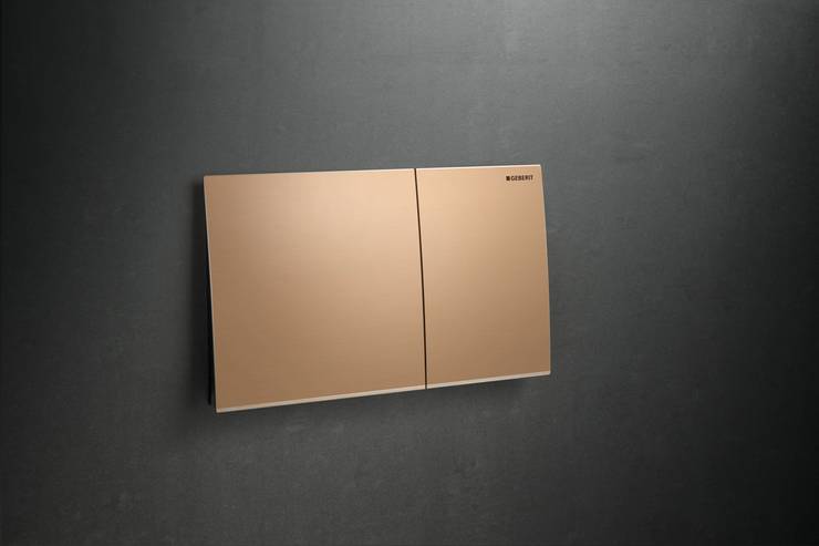 A red-gold Sigma70 flush plate manufactured by Geberit