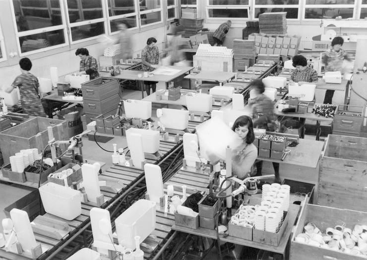 A photo, taken in the 1960's, of a production line for PVC cisterns