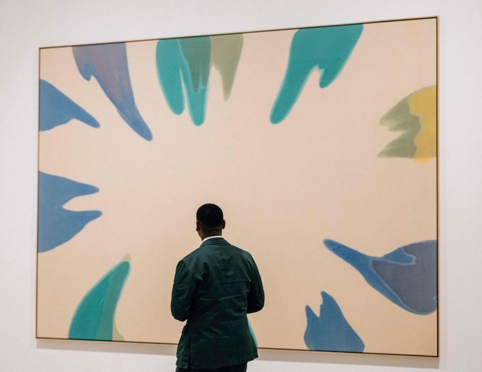 Franklin Sirmans looking at a painting in the Pérez Art Museum Miami