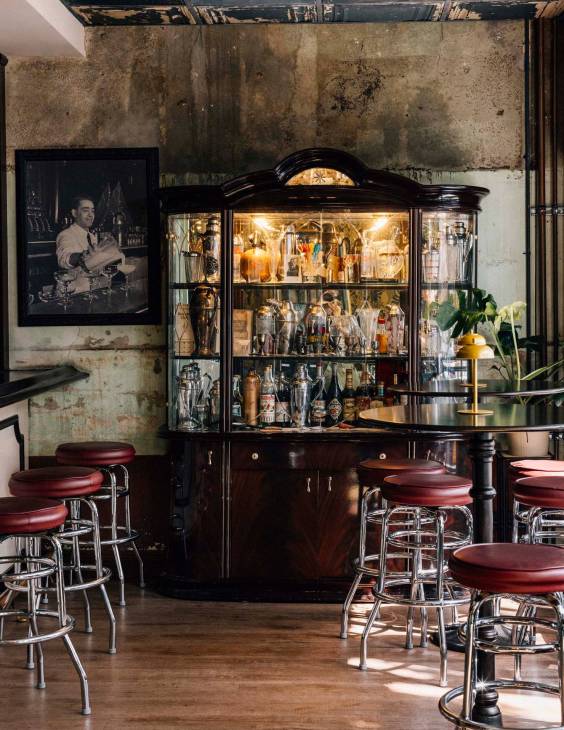 A drinks cabinet and bar stalls at Cafe La Trova.