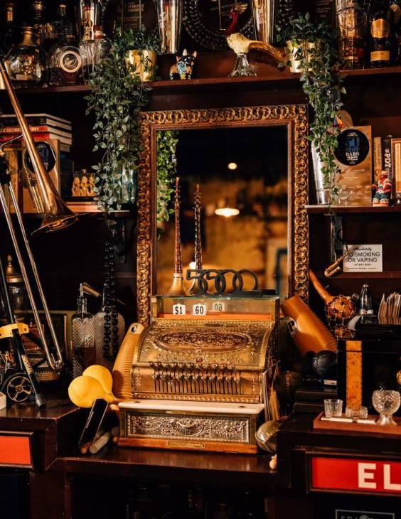 A golden cash register at Cafe La Trova