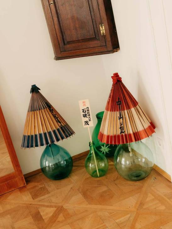 Japanese umbrellas inside glass pots.