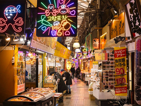 A street in Osaka, Japan with neon lights.