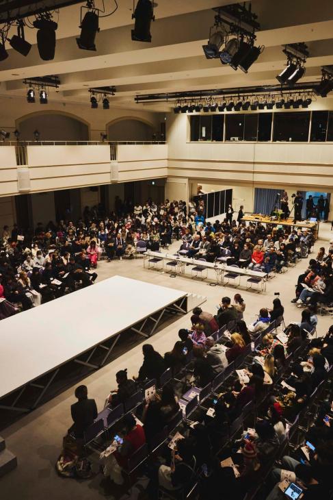 Students and teachers waiting for the runway final of the annual design contest