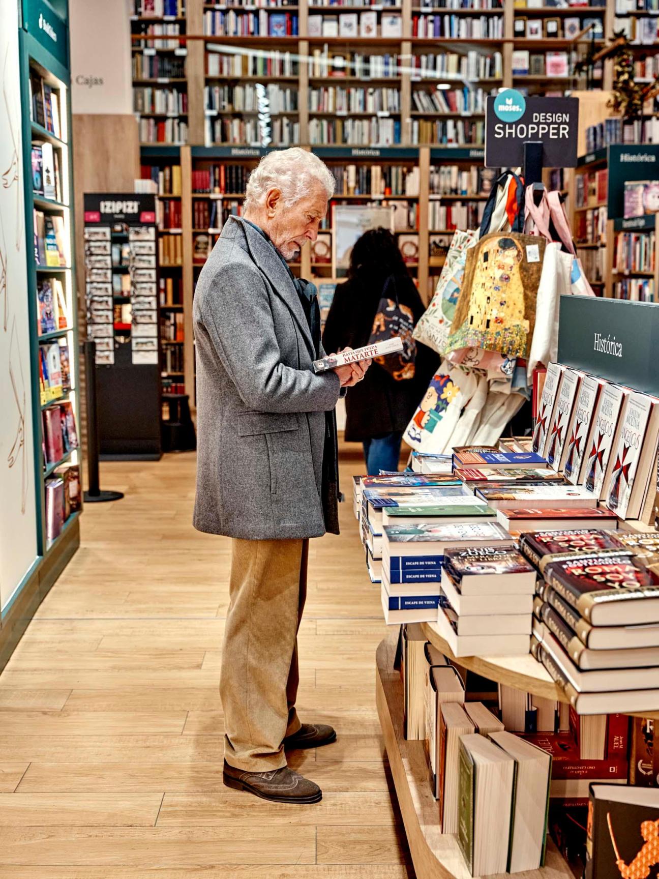 old man in a bookstore