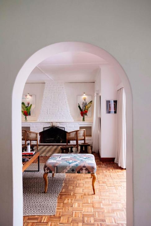 view of the living room through an arched door