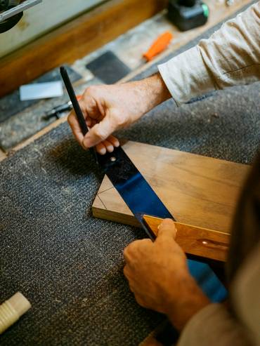 Stefan Senn measuring wood.