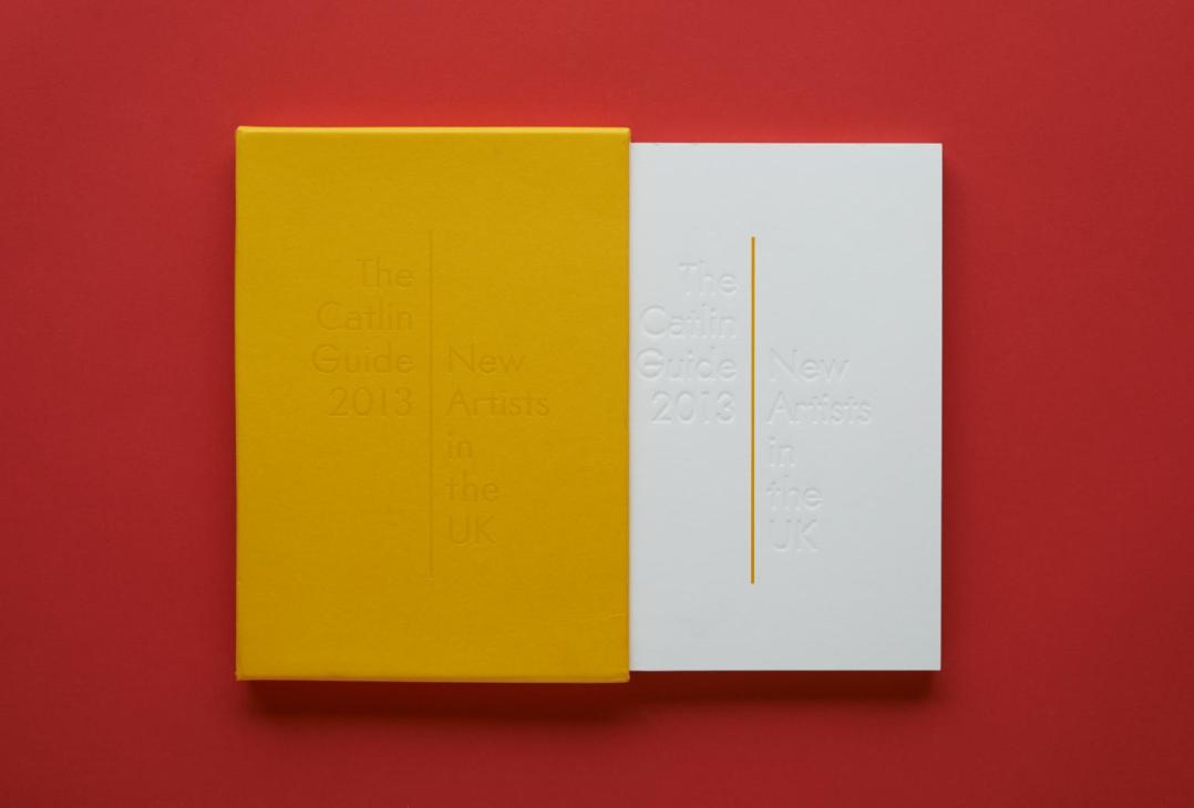The Catlin Art Guide book with yellow and white cover displayed against a red background.