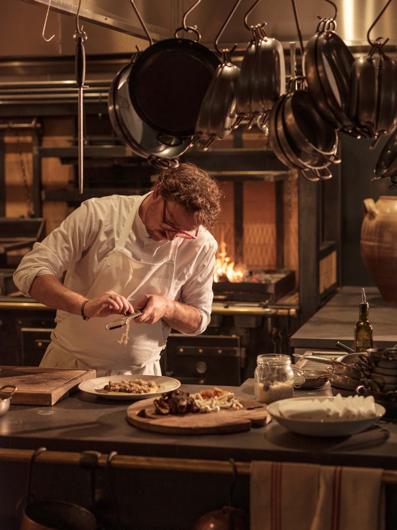 Chef preparing mushroom and polenta in the kitchen