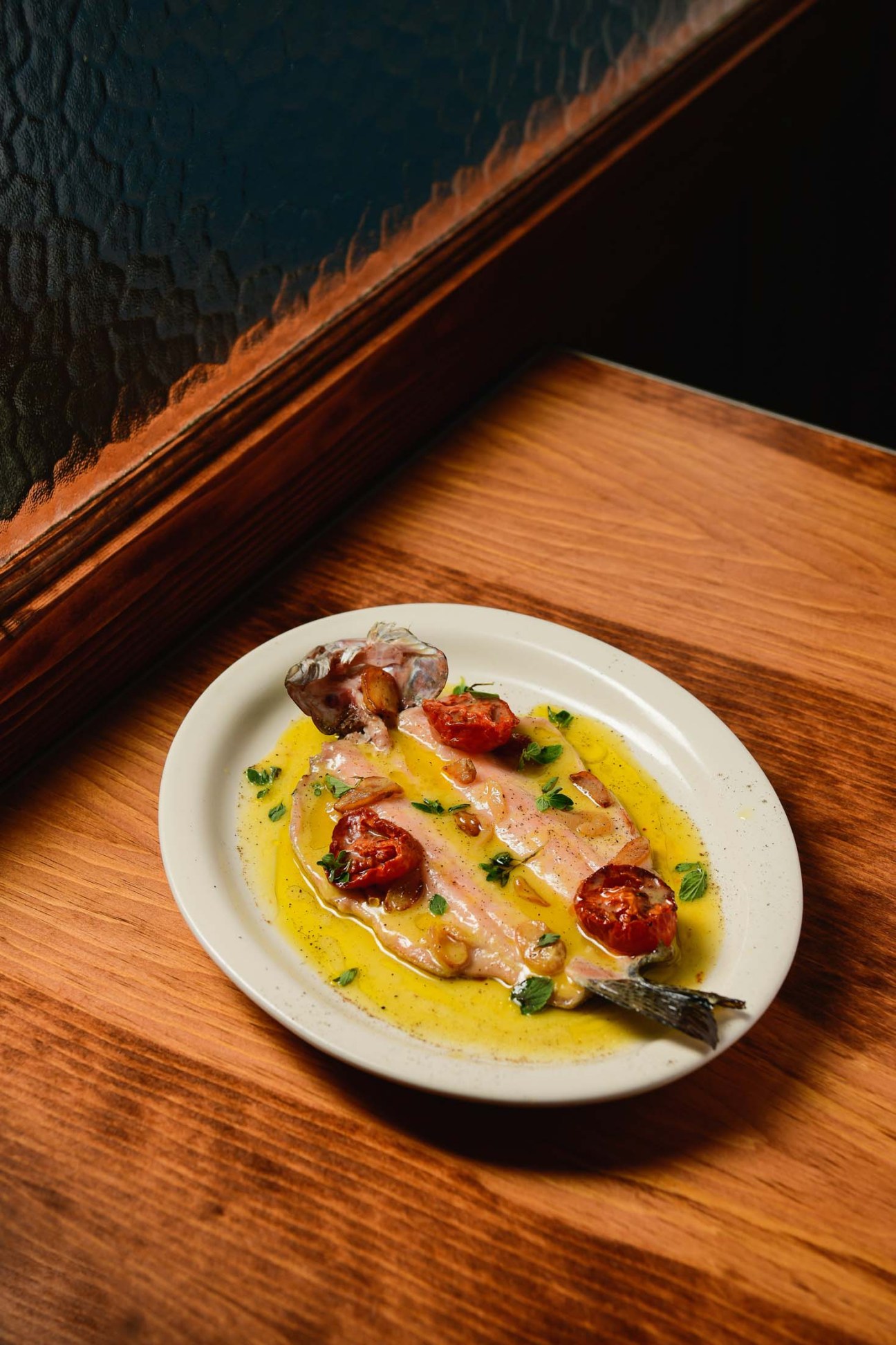 Fish dish with roasted tomatoes