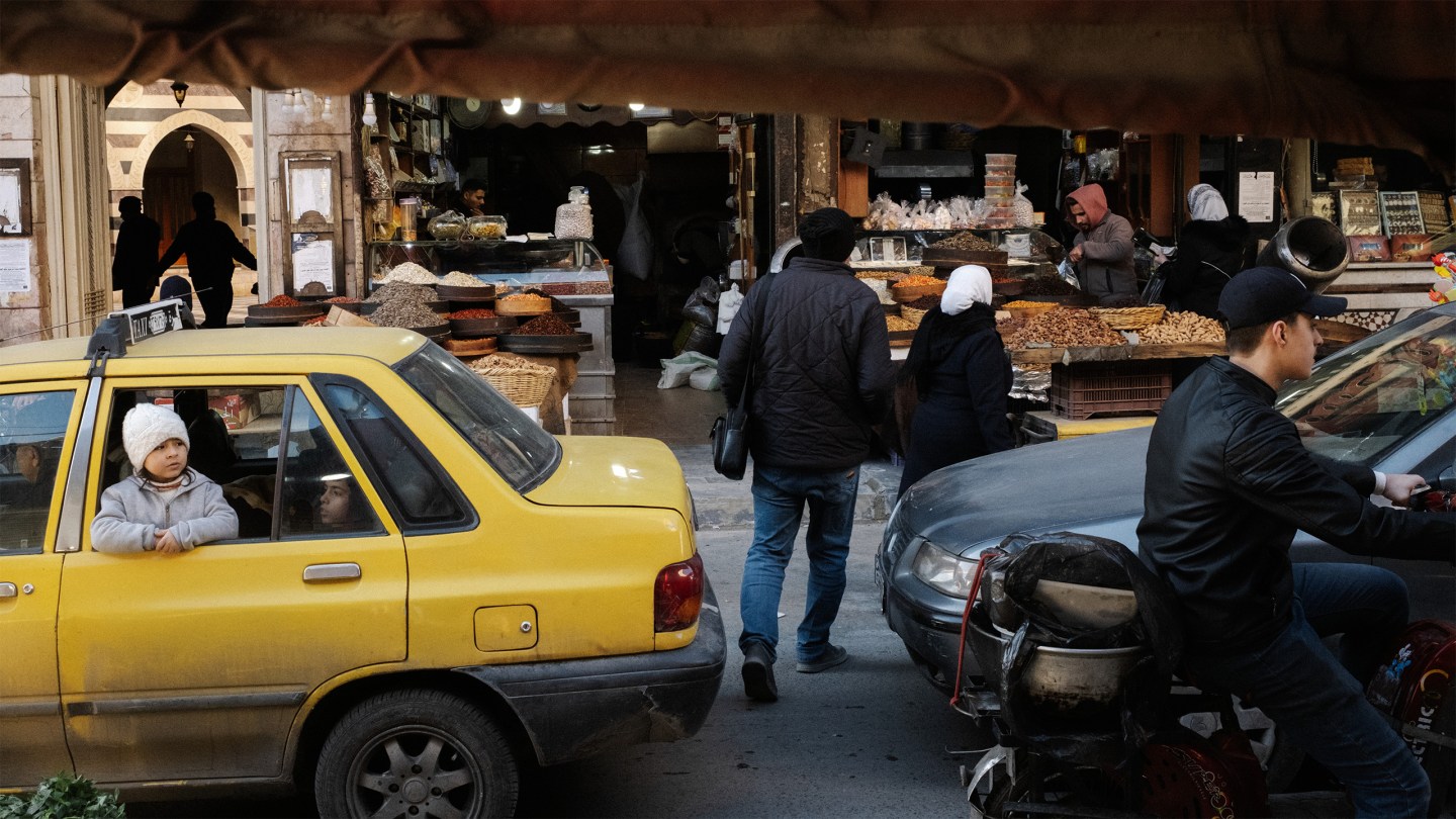 Syria, Damascus, 2025. A girl looks out from the car window in Milan Jazmetieh district in Damascus.