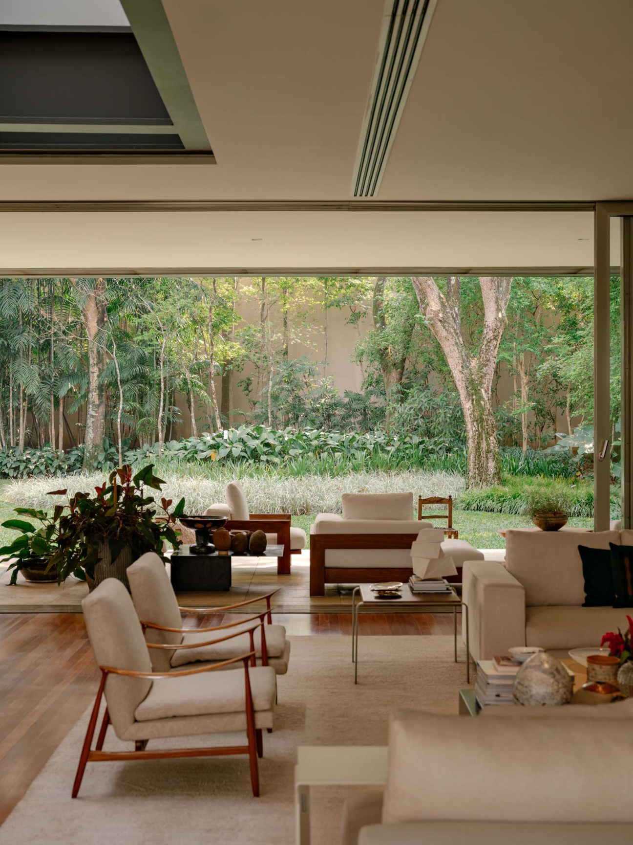Neutral tones contrast with the lush landscape