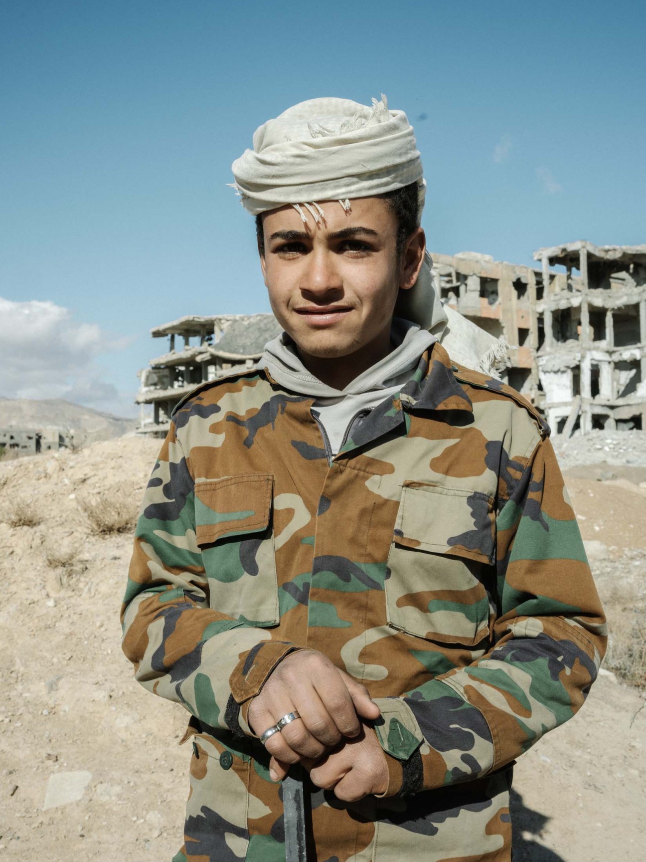 Syria, Damascus, 2025. Suleyman al Awwad, shepherd from Ghouta bringing his sheep to Jobar that has been completely destroyed by the fighting. hHerd of sheep tries to satisfy their hunger with whatever green they can find in the ruins.
