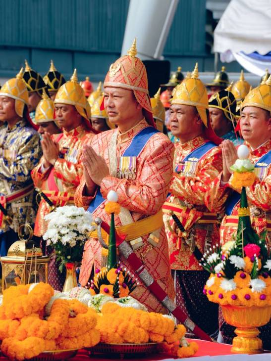 Participants in the barge procession in Thailand