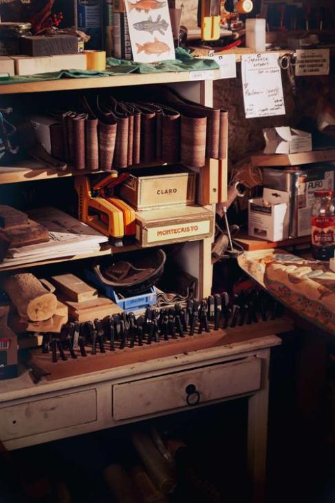 Objects and tools upon a desk.