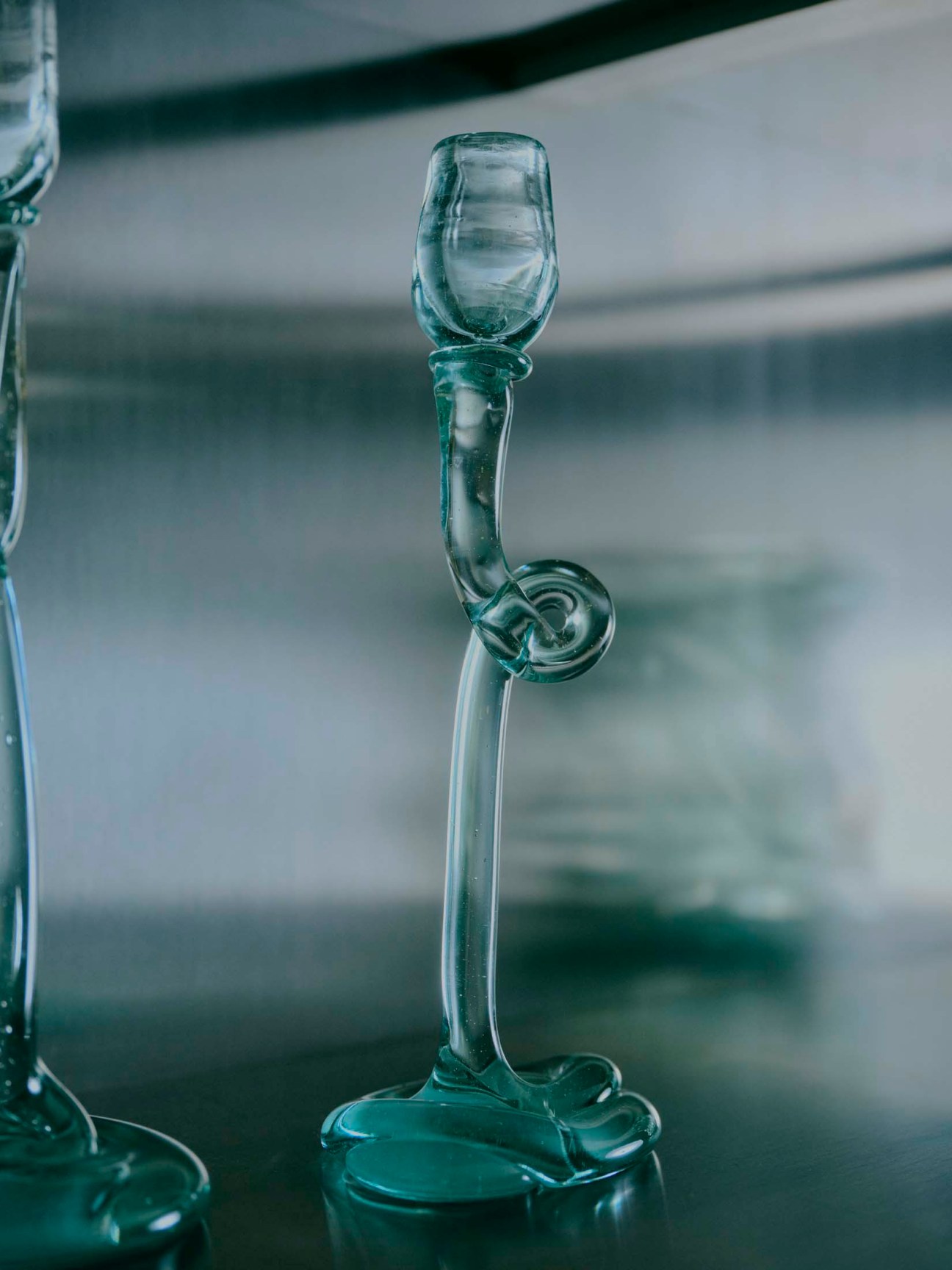 Recycled glass candlestick featuring Jewsbury’s signature swirls