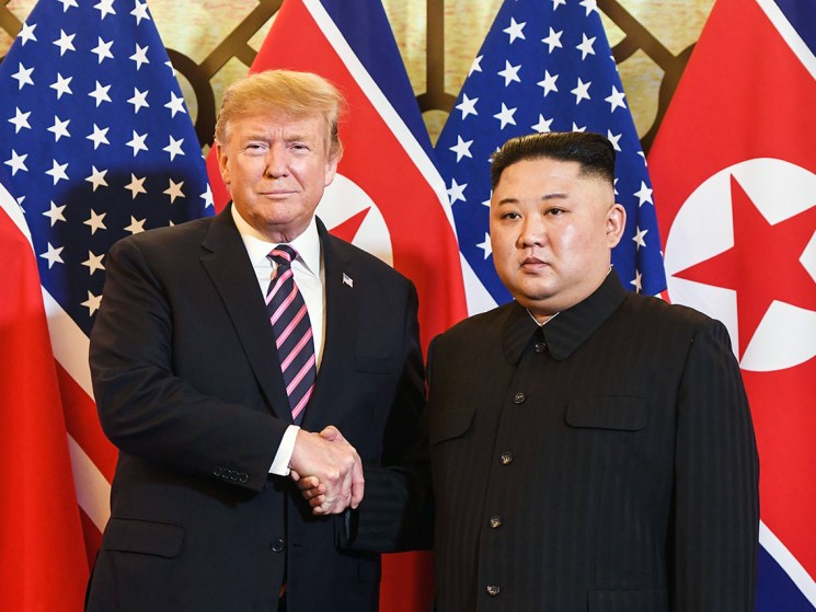 Donald Trump shaking hands with Kim Jong Un