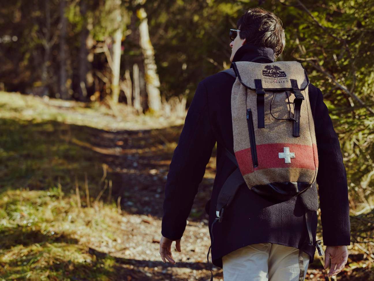 A hiker wearing a fondue backpack.