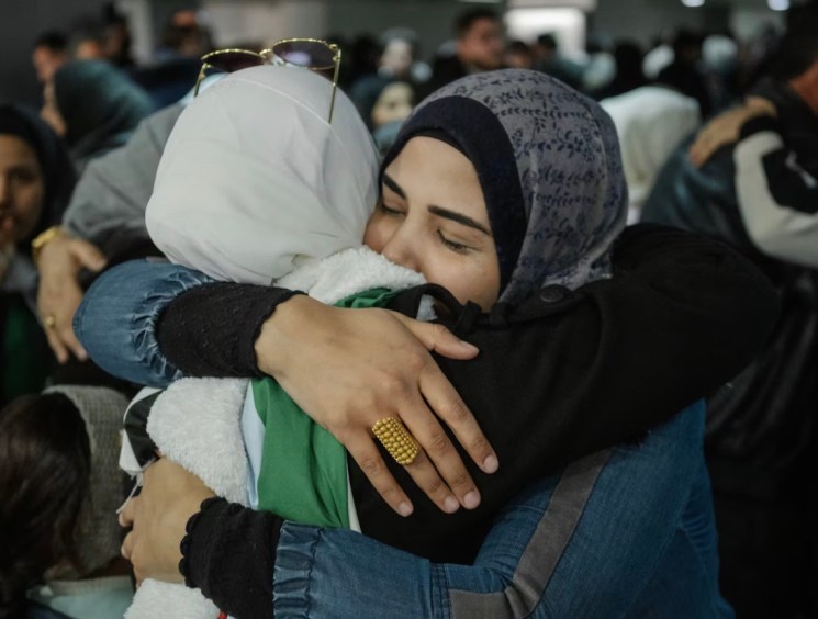two Syrian women embracing