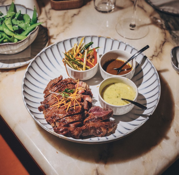 Steak and sauces in bowls at Beast restaurant
