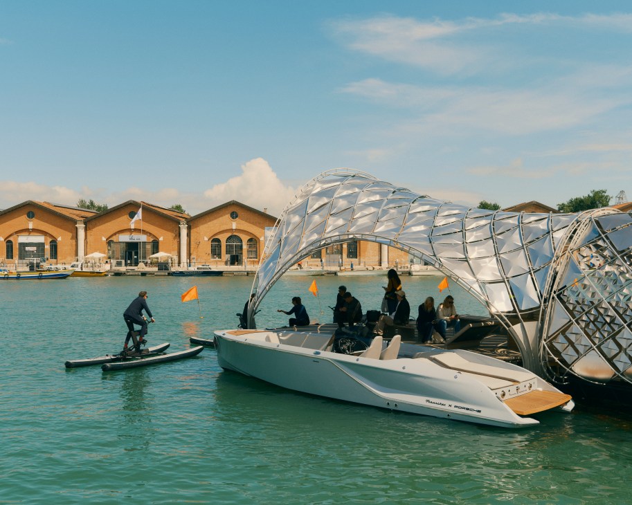 Water bikes and motorboats with shimmering shell structure at Venice Biennale