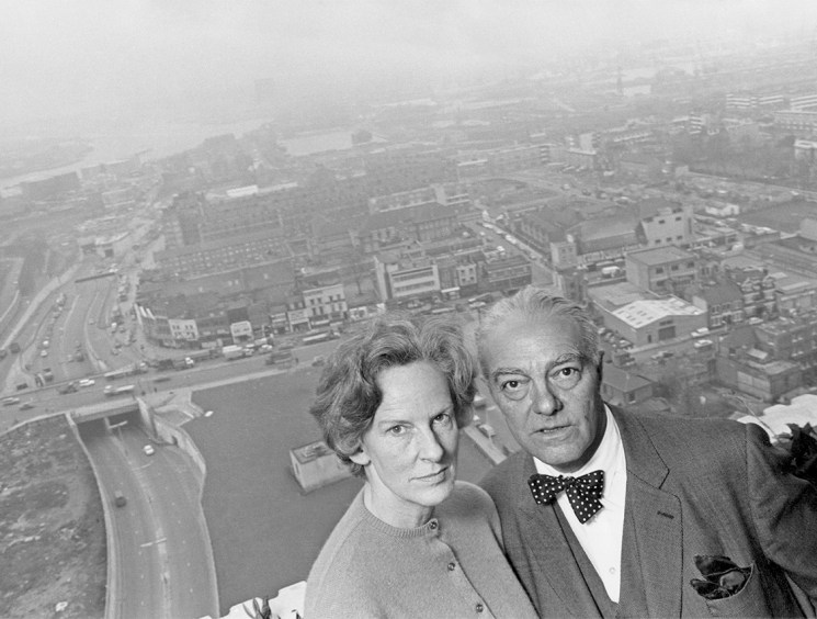 Goldfinger and his wife, Ursula, on the balcony of their 24th floor flat in Balfron Tower. As Balfron Tower's architect, he lived in the building to discover the advantages and disadvantages of life in a high-rise property (Image: Hulton Archive/Getty Images)