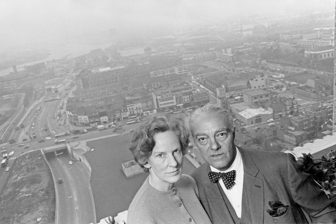 Goldfinger and his wife, Ursula, on the balcony of their 24th floor flat in Balfron Tower. As Balfron Tower's architect, he lived in the building to discover the advantages and disadvantages of life in a high-rise property (Image: Hulton Archive/Getty Images)