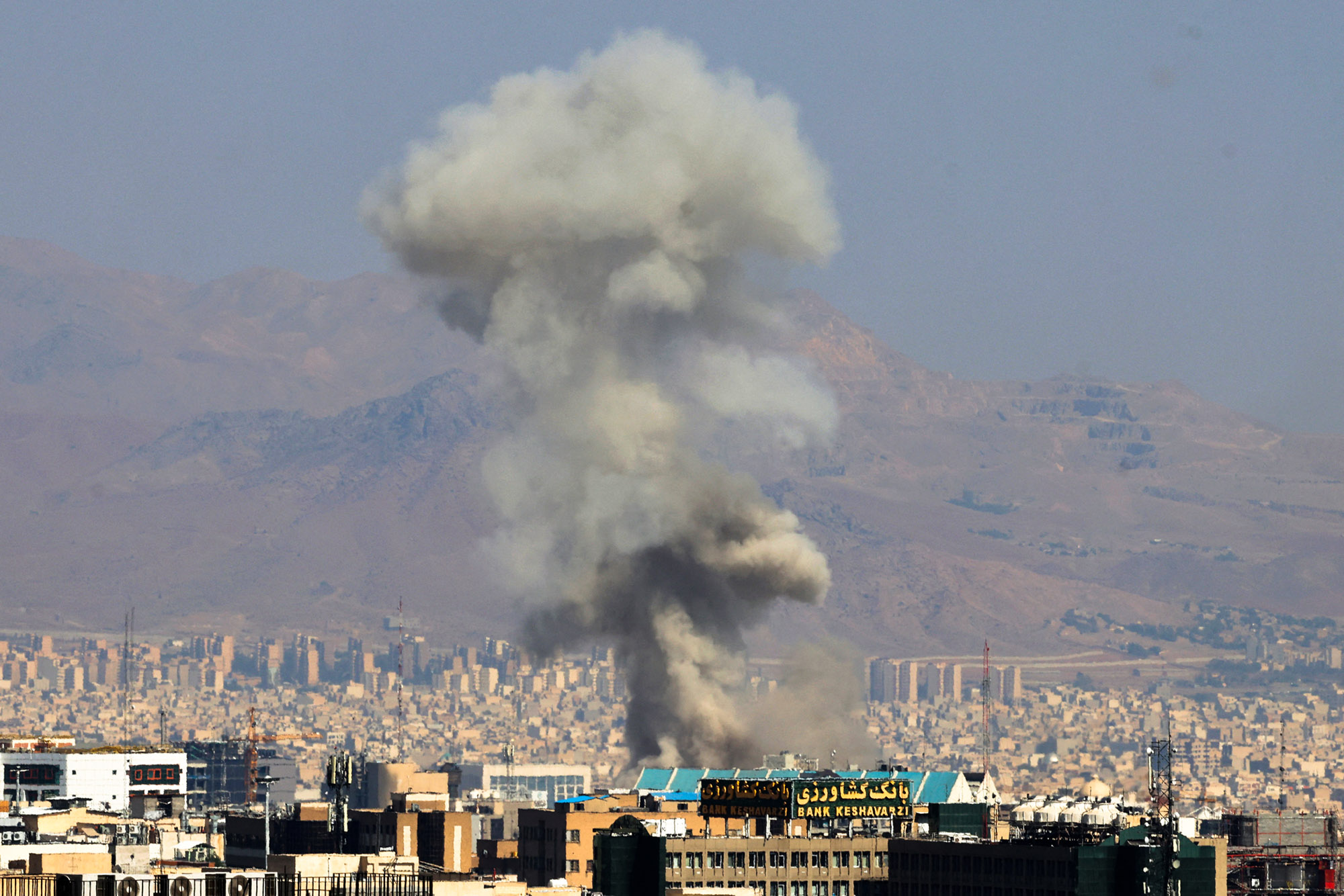 Smoke billows following an explosion in central Tehran on June 15, 2025.