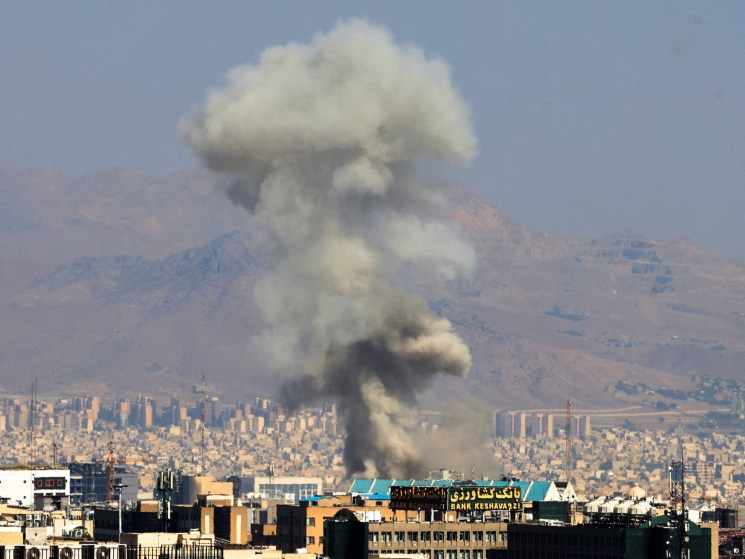 Smoke billows following an explosion in central Tehran on June 15, 2025.