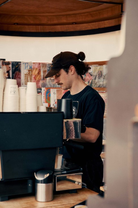 Man making coffee with cap