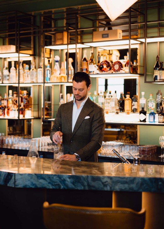 A bartender at The Rosewood Amsterdam