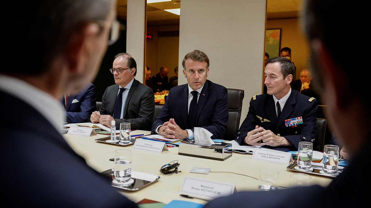 French President Emmanuel Macron (C}, flanked by Presidency General Secretary Emmanuel Moulin (L) and Chief of Military Staff of the President of the Republic (CEMP) Fabien Mandon, holds a Defence and National Security Council meeting following US air strikes on nuclear facilities in Iran, at the Elysee Palace in Paris on June 22, 2025.