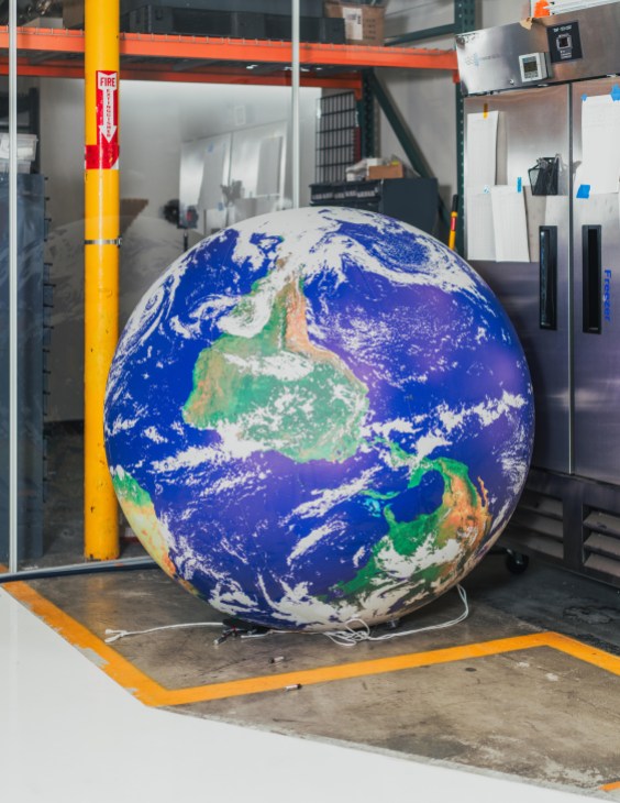 A model globe inside the Reflect Orbital laboratory space