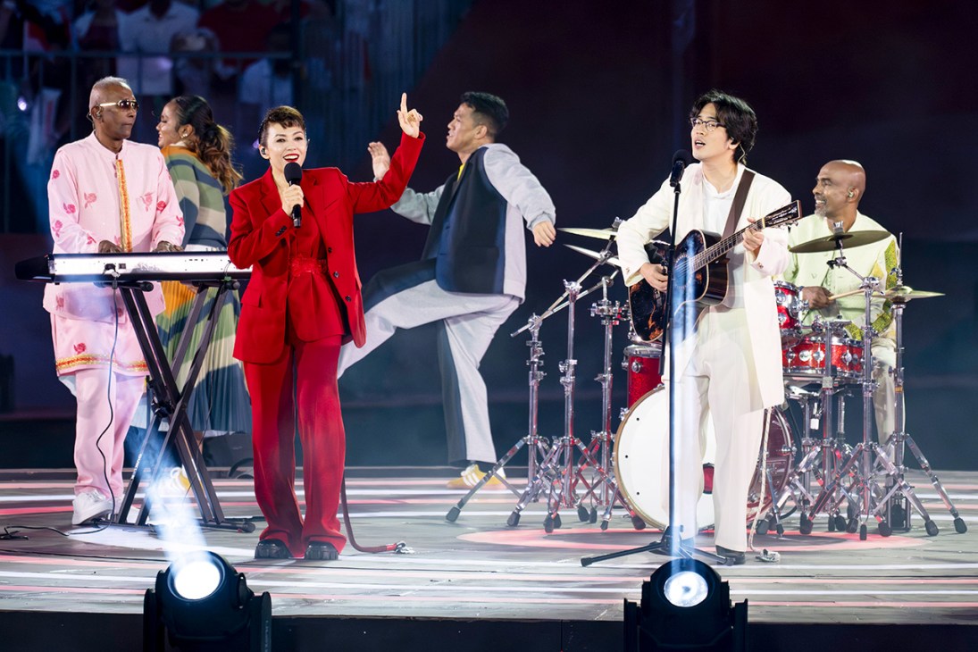Kit Chan and Charlie Lim performing Singapore National Day song Here We Are at a NDP 2025 preview