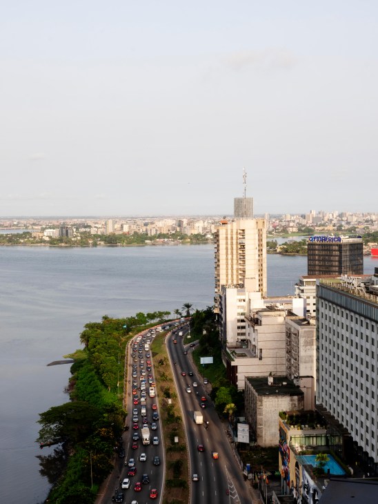 Busy lagoon-side road in Abidjan