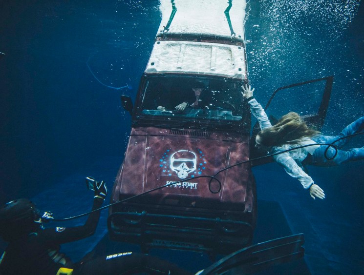 Students performing a daring escape in the Water Tank