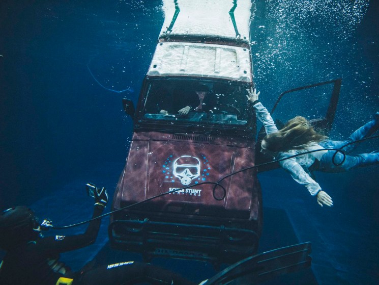 Students performing a daring escape in the Water Tank