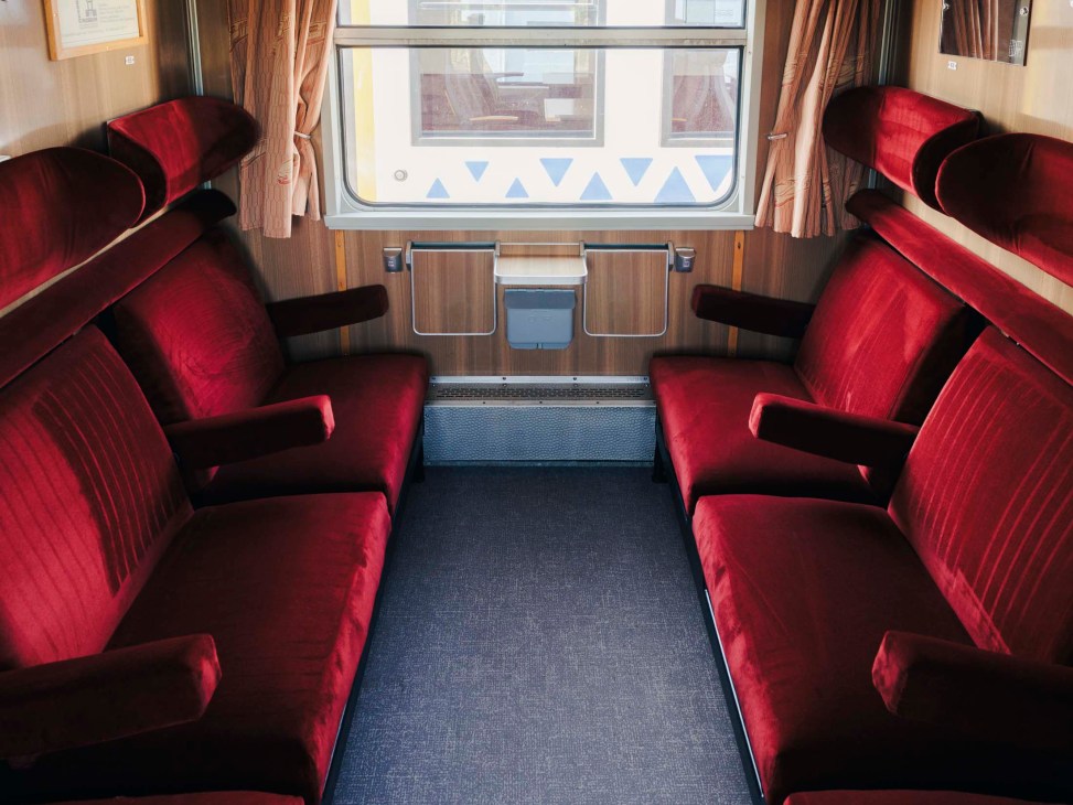 Newly reupholstered deep-red seating in SVT Görlitz train