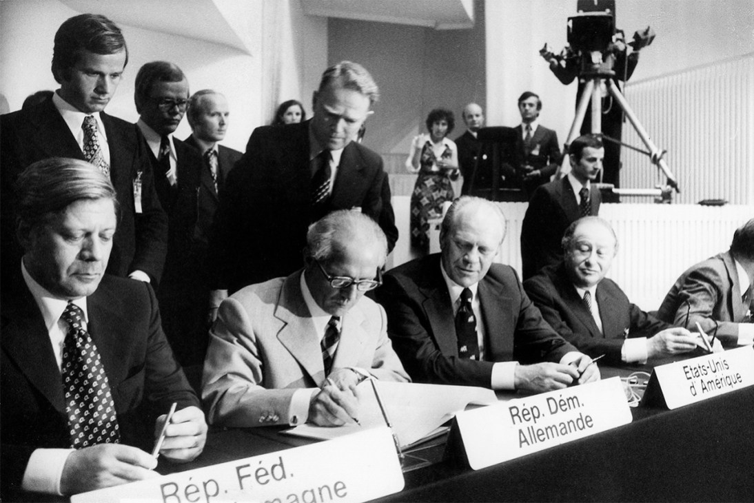 Sign of the times: Helmut Schmidt (left), Erich Honecker (middle) and Gerald Ford (right) put pen to paper on the Helsinki Final Act, 1975