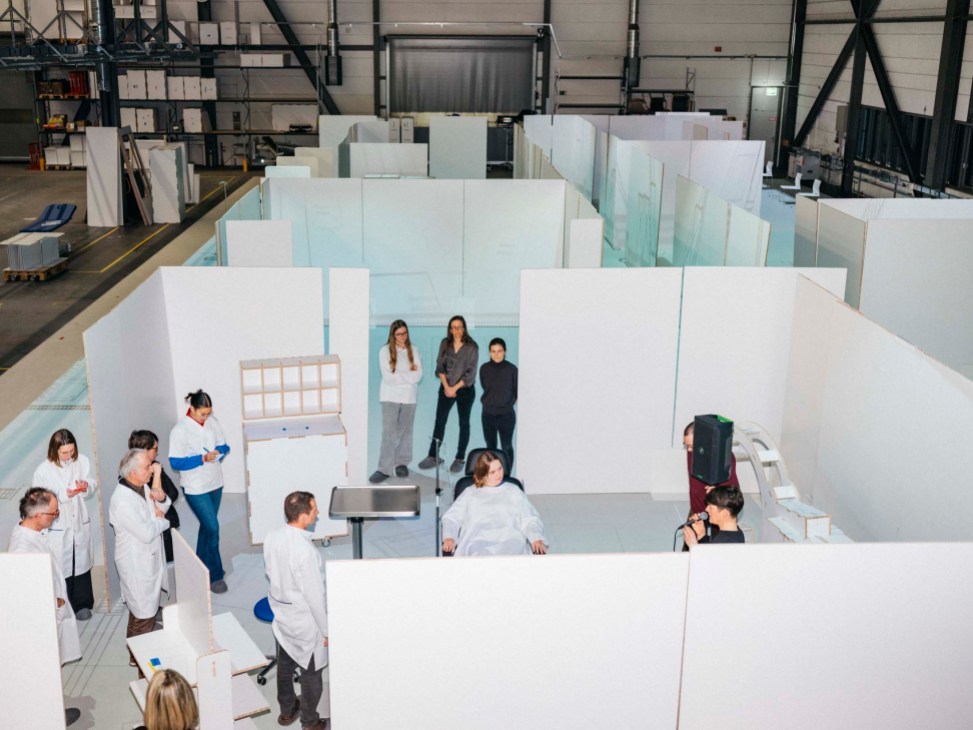 People stress-testing a mock hospital