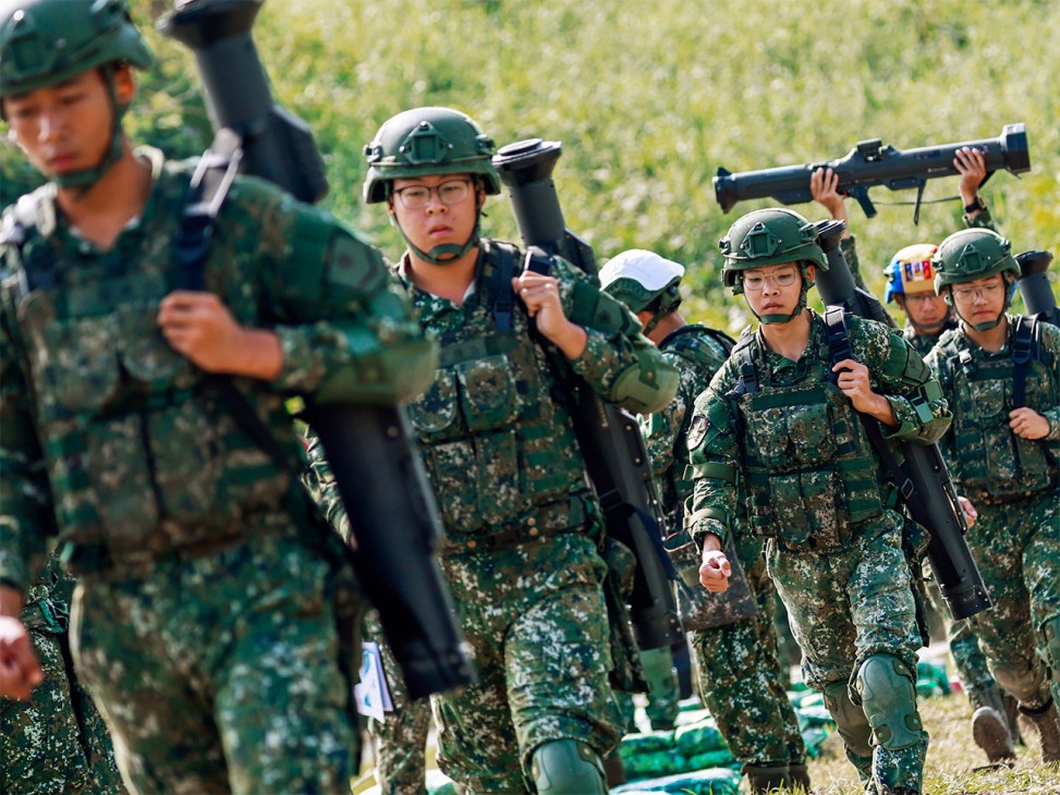 Under the gun: Taiwanese conscripts taking part in a live-fire exercise
