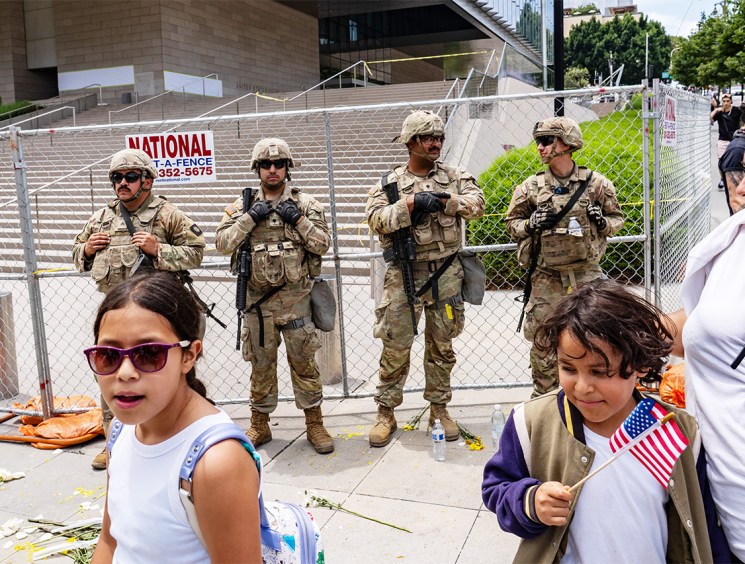 On the defensive: National Guards outside a federal building during the ‘No Kings’ protest in Los Angeles (Image: Getty)