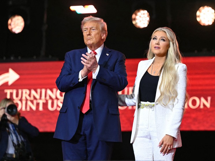 US President Donald Trump reacts next to Erika Kirk, widow of Charlie Kirk, after speaking at the public memorial service for right-wing activist Charlie Kirk at State Farm Stadium in Glendale, Arizona, on September 21, 2025. (Photo by Mandel NGAN / AFP) (Photo by MANDEL NGAN/AFP via Getty Images)