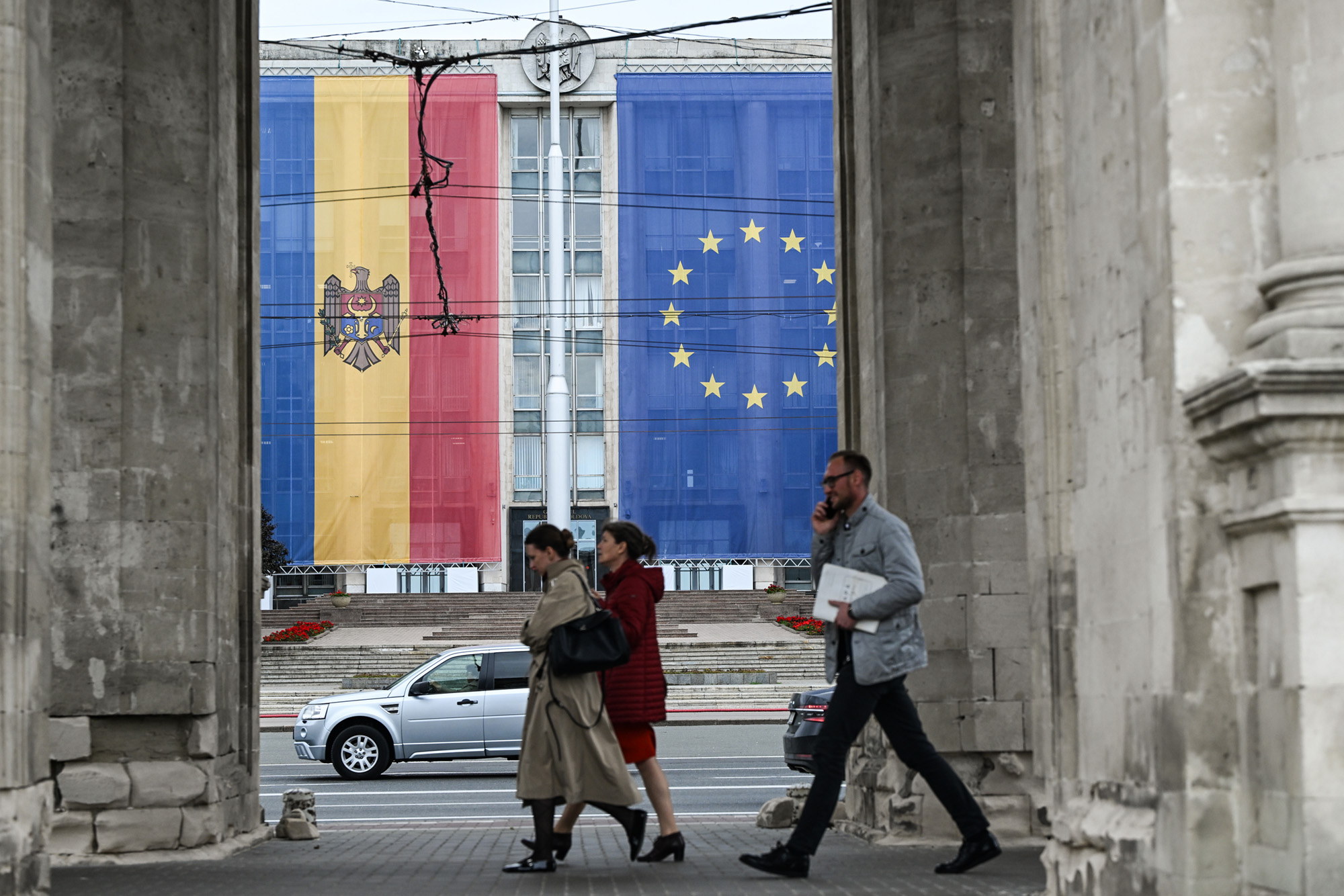 CHISINAU, MOLDOVA SEPTEMBER 25: Moldovian and European Union flags are displayed on the facade of the Government House of Moldova ahead of the parliamentary elections in Chisinau, Moldova, on September 25, 2025. (Photo by Artur Widak/NurPhoto via Getty Images)