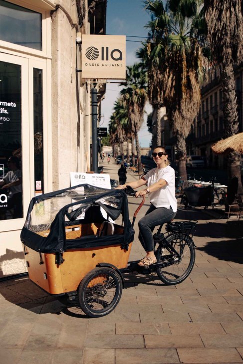 Delphine, 39, is customer advisor. She enjoys crossing the city with her cargo bike. September 2nd 2025 for Monocle.