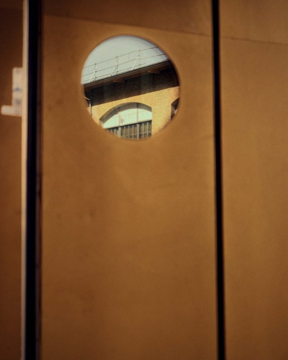 A door with a glass window shot by Sigma BF