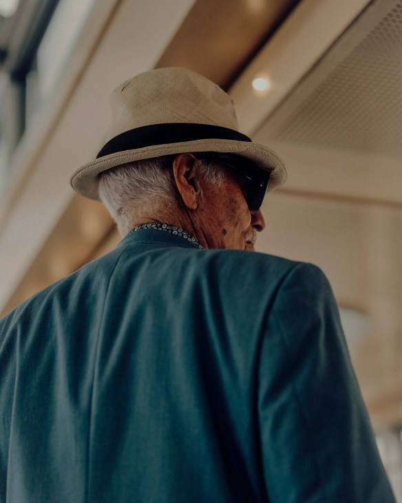 A man wearing a straw hat shot by Sigma BF